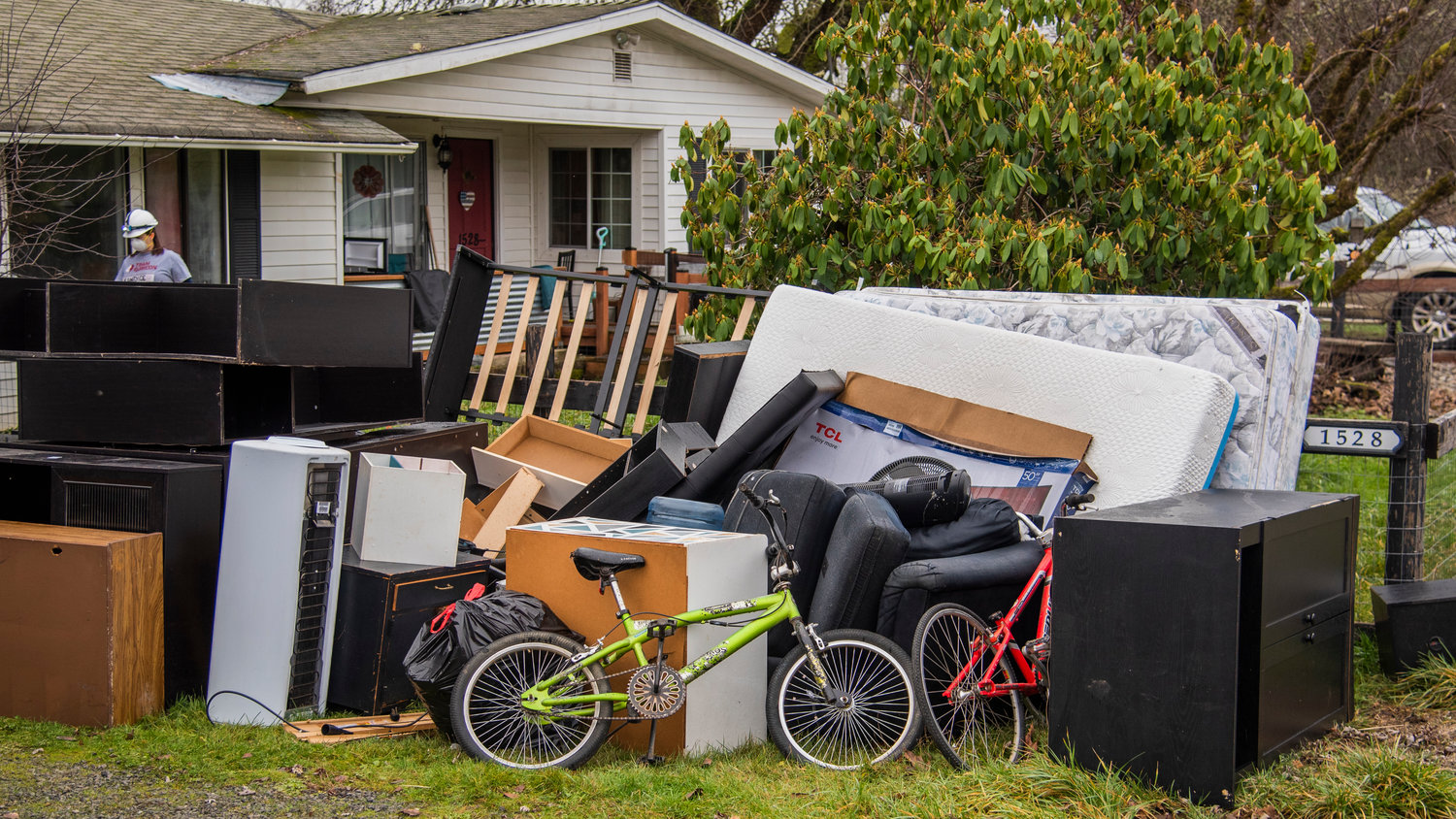 Personal items and furniture damaged in the flood sit outside the Pardue home along Ceres Hill Road in Centralia on Sunday.
