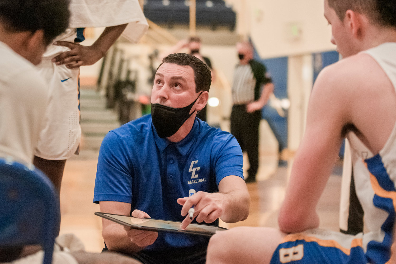 Head Coach Jason Moir talks to players courtside during a game Wednesday night at Centralia College.