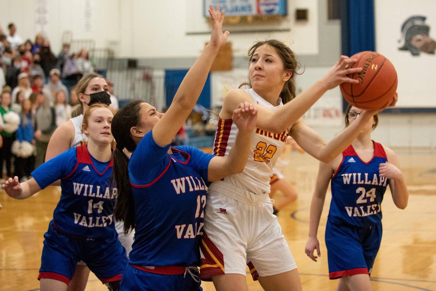 Pe Ell's Charlie Carper (22) hauls in a rebound for Winlock against Willapa Valley on Jan. 21