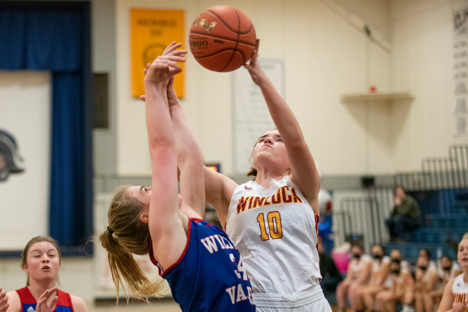 Winlock's Madison Vigre (10) battles for a rebound with a Willapa Valley player on Jan. 21.