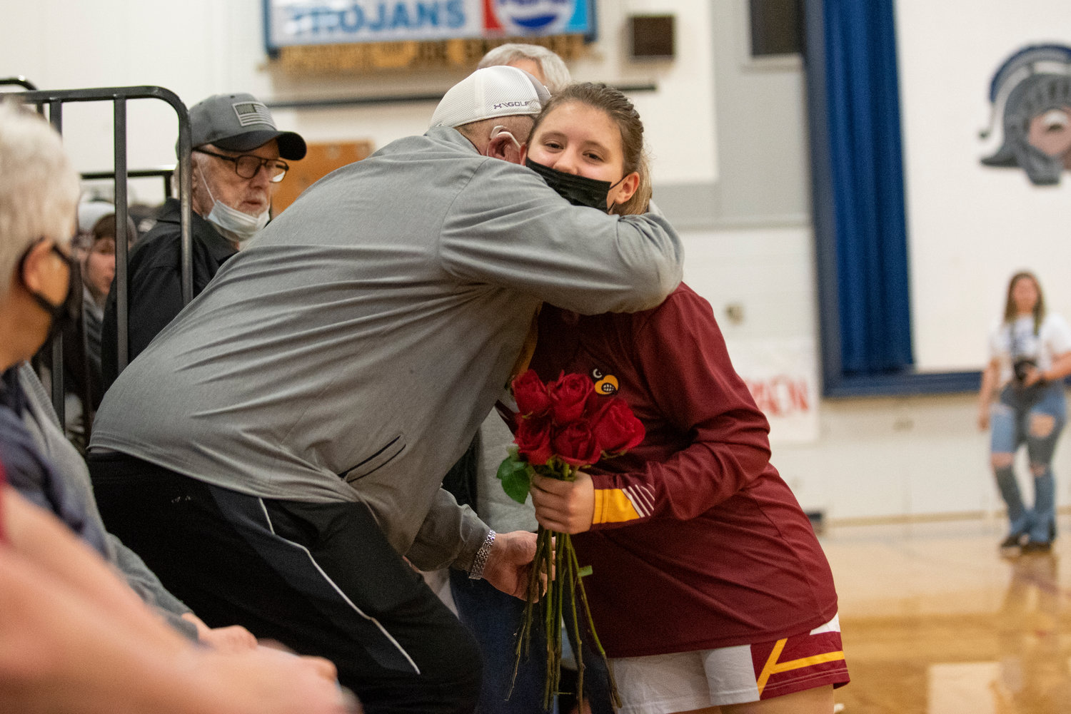 Pe Ell senior Kayla Miller hugs a family member after being honored pre-game during Winlock's senior night at Pe Ell High School on Jan. 21.