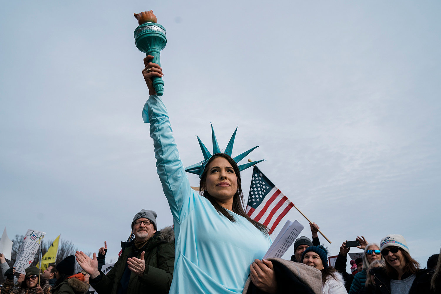 A woman dressed as the Statue of Liberty poses during a Defeat the Mandates Rally, on National Mall on Sunday, Jan. 23, 2022, in Washington, DC. Demonstrators are protesting mask and COVID-19 vaccination mandates. (Kent Nishimura/Los Angeles Times/TNS)