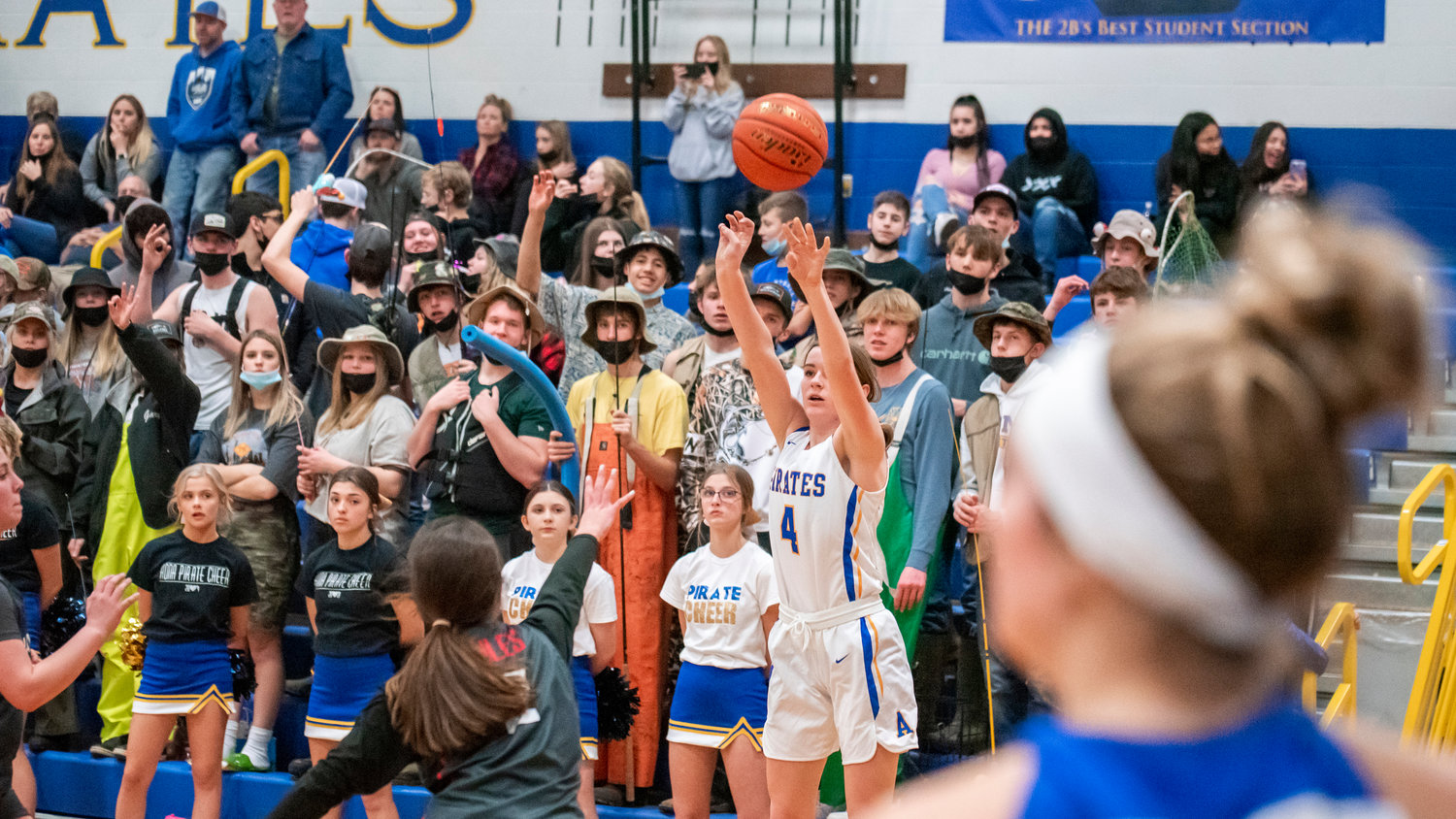 Adna’s Brooklyn Loose (4) makes a three-point shot over Wahkiakum defenders Monday night.