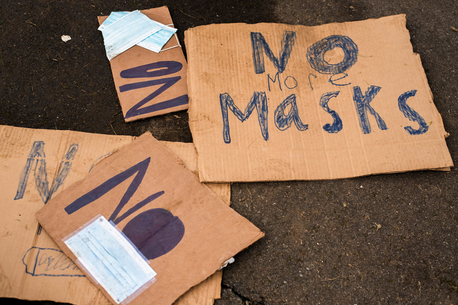 Signs are seen scattered along blacktop outside the Pe Ell School District building as students continued to protest the mask mandate early this month.