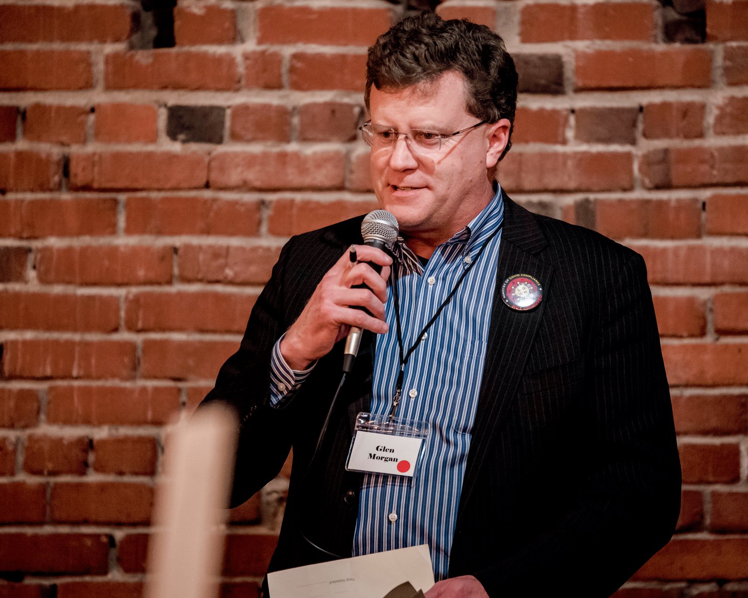 Glen Morgan uses a microphone to address attendees of the Lewis County Republicans' Lincoln Day Dinner in Chehalis in February.