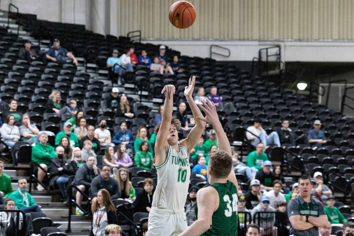 Tumwater guard Andrew Collins takes a 3-pointer against Port Angeles in the 2A State Fourth-Place game at the Yakima Valley SunDome March 5.