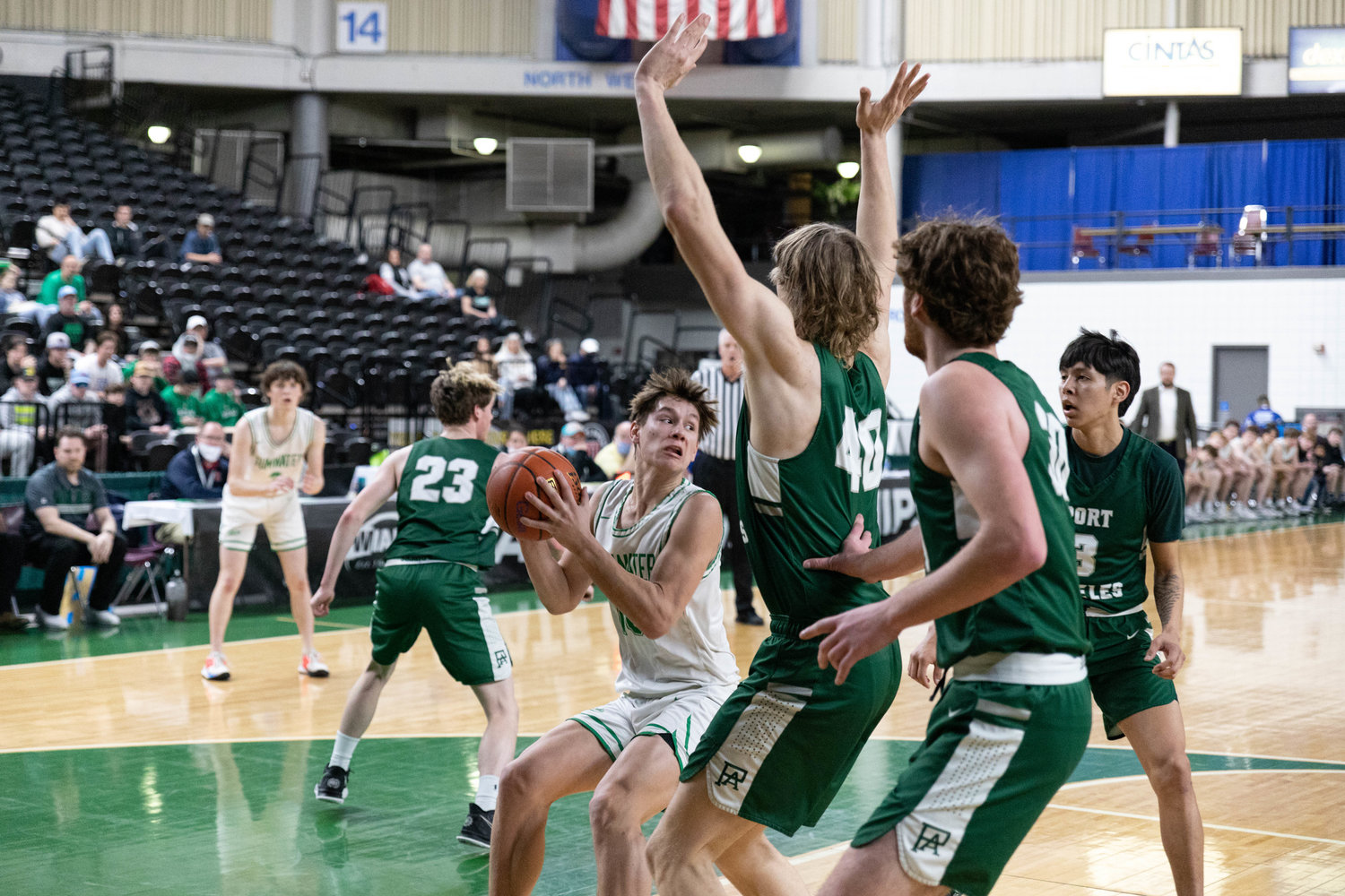 Tumwater guard Andrew Collins looks to pass in the paint against Port Angeles in the 2A State Fourth-Place game at the Yakima Valley SunDome March 5.