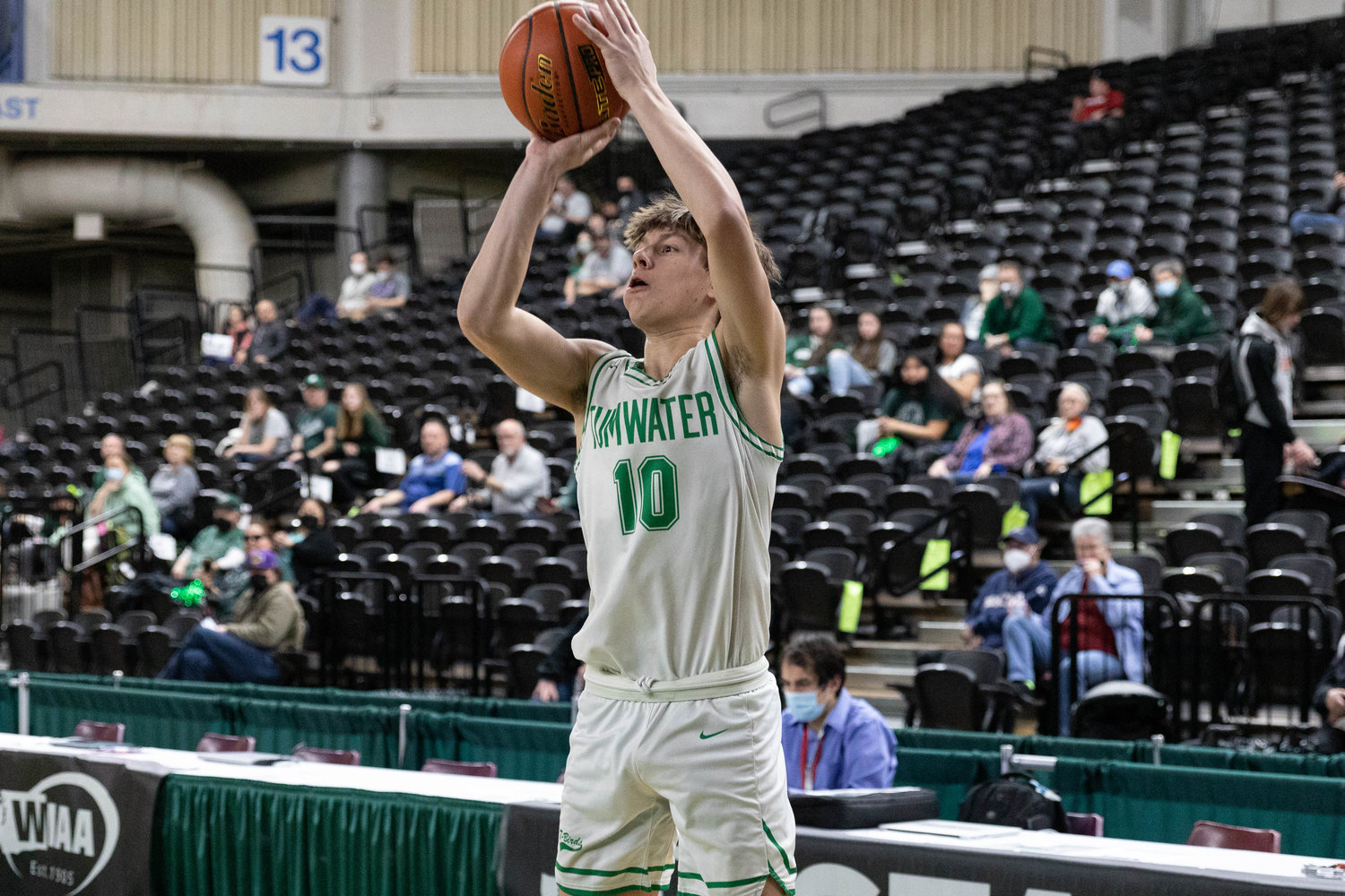 Tumwater guard Andrew Collins takes a 3-pointer against Port Angeles in the 2A State Fourth-Place game at the Yakima Valley SunDome March 5.