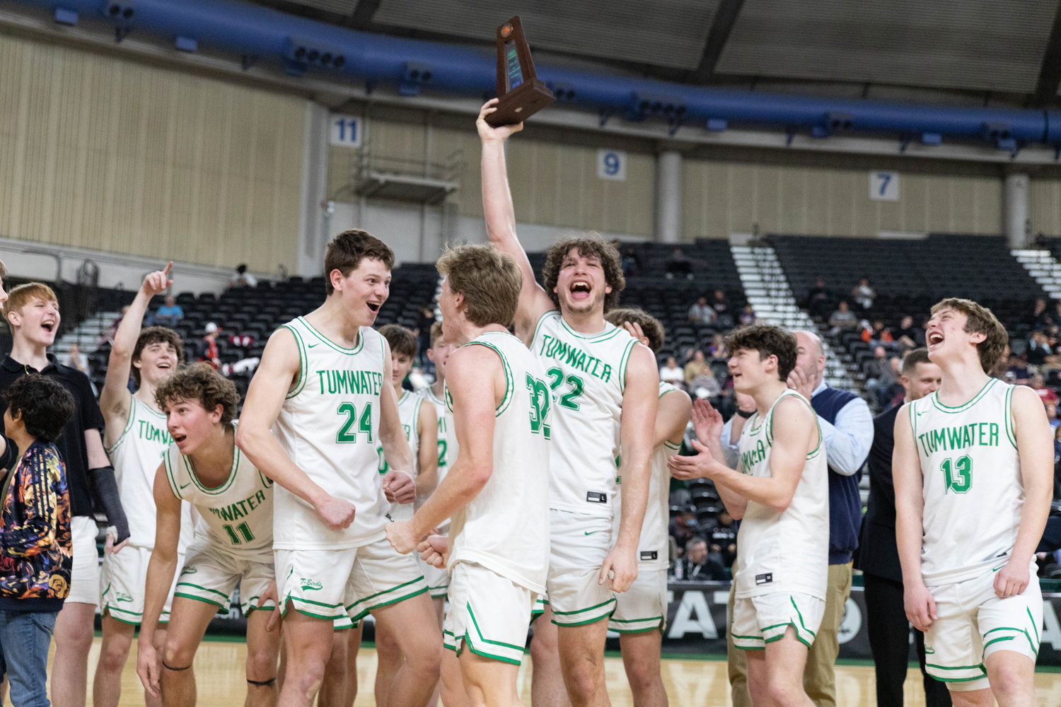 Tumwater forward Ryan Otton holds up the fourth-place trophy at the 2A state tournament in Yakima March 5.