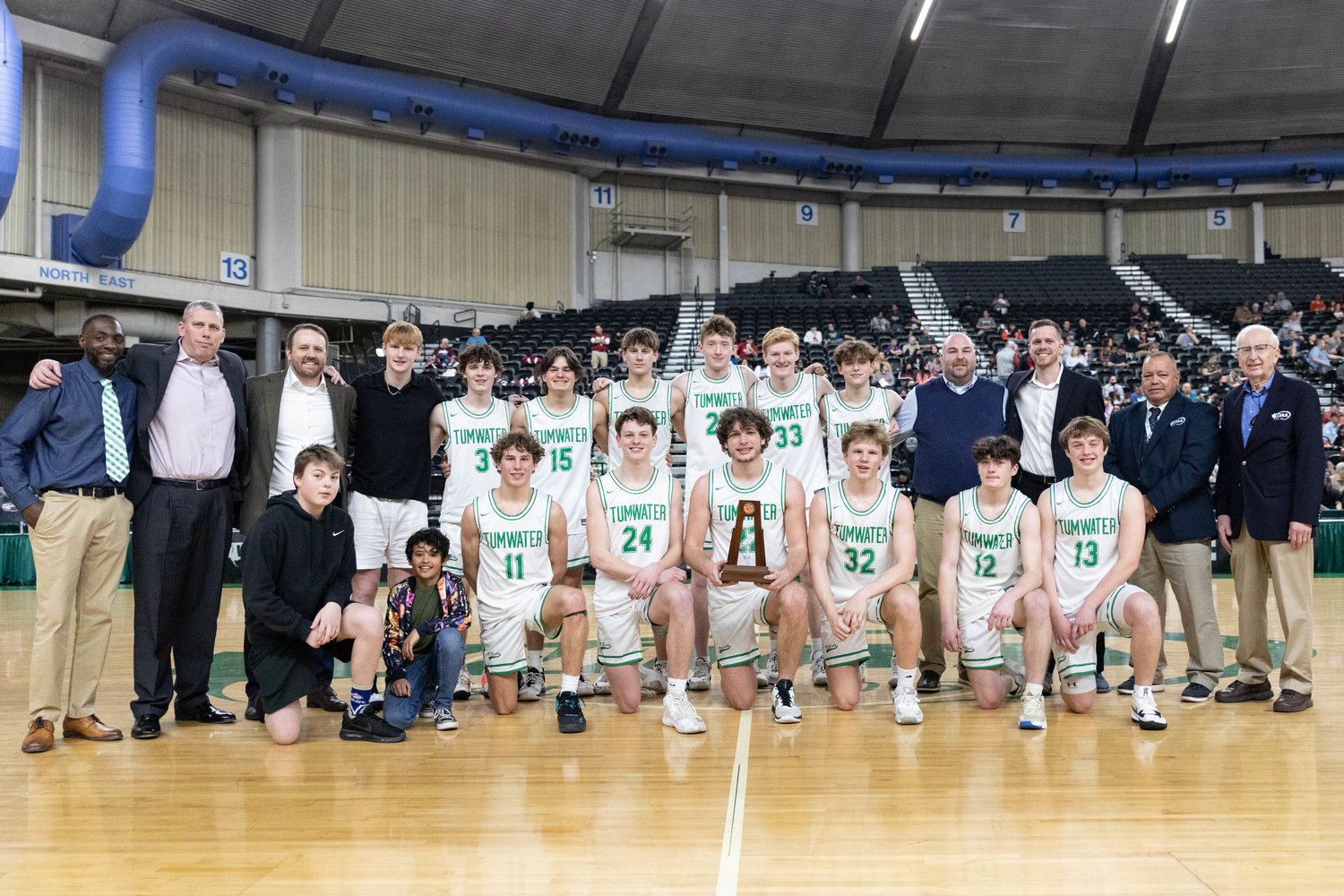 The Tumwater boys basketball team poses with the fourth-place trophy at the 2A state tournament in Yakima March 5.