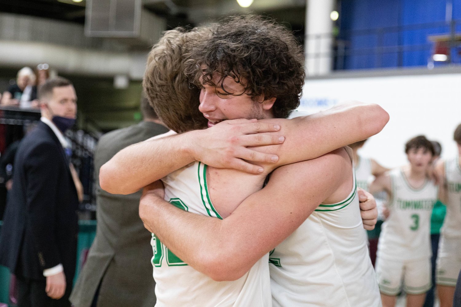 Tumwater forward Ryan Otton hugs senior teammate Adam Overbay after the T-Birds beat Port Angeles to finish fourth at state, their highest finish at state since 1976.