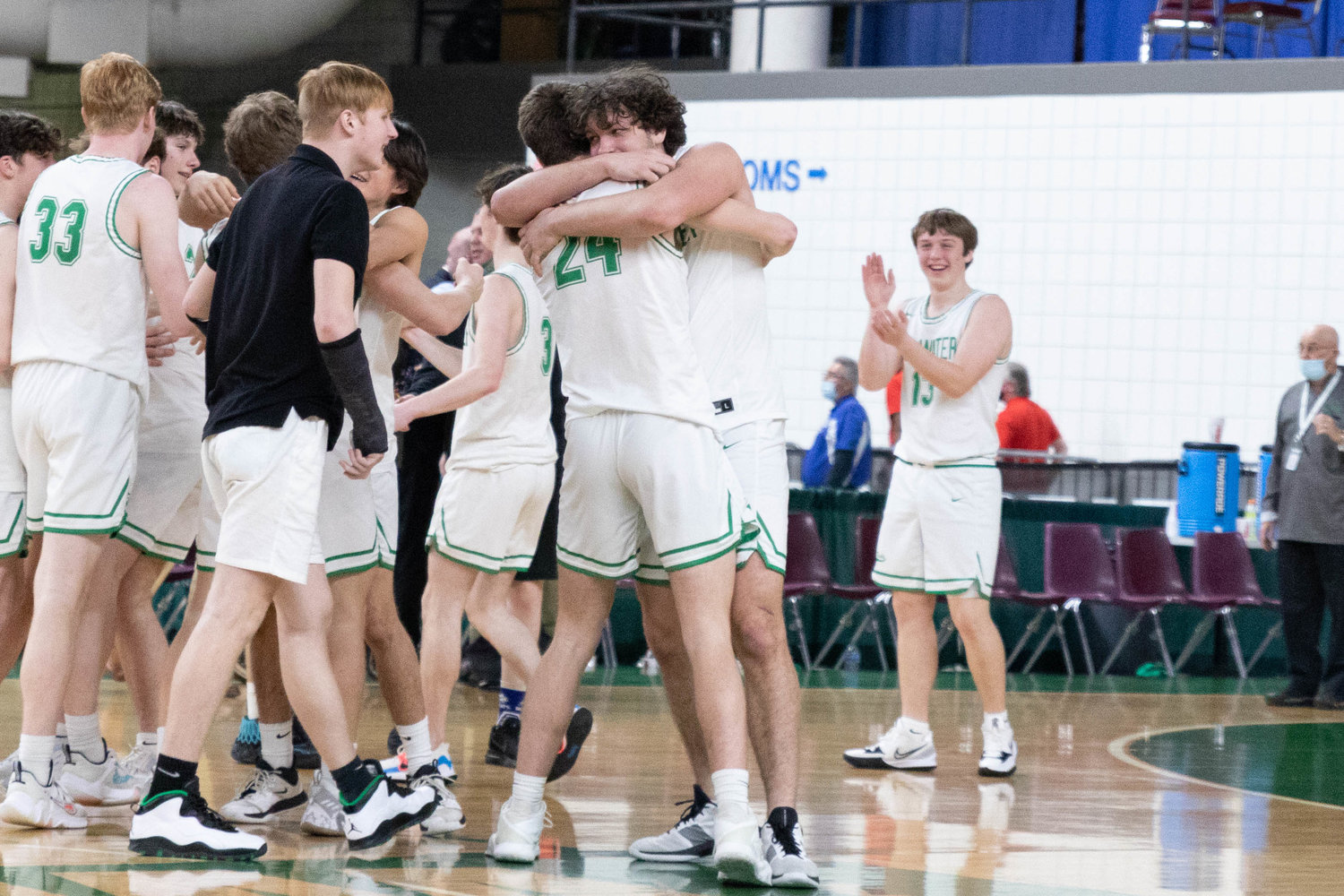 Tumwater forward Ryan Otton hugs senior teammate Seth Weller after the T-Birds beat Port Angeles to finish fourth at state, their highest finish at state since 1976.