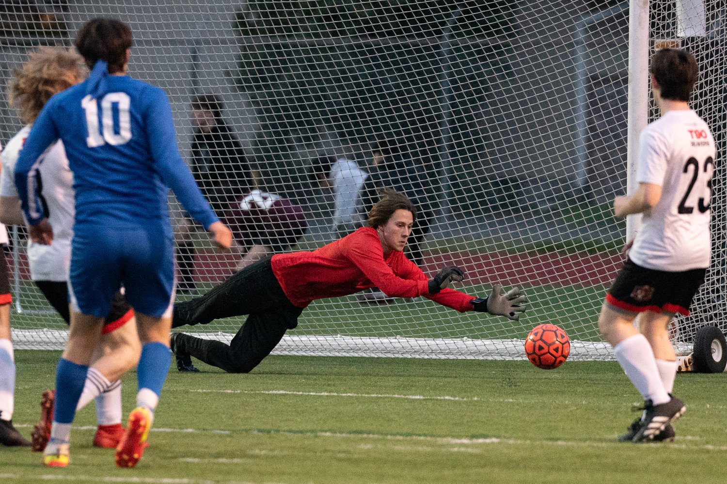 Tenino keeper Alex Reichelderfer stretches for a save against Rochester at the Centralia Jamboree March 10.