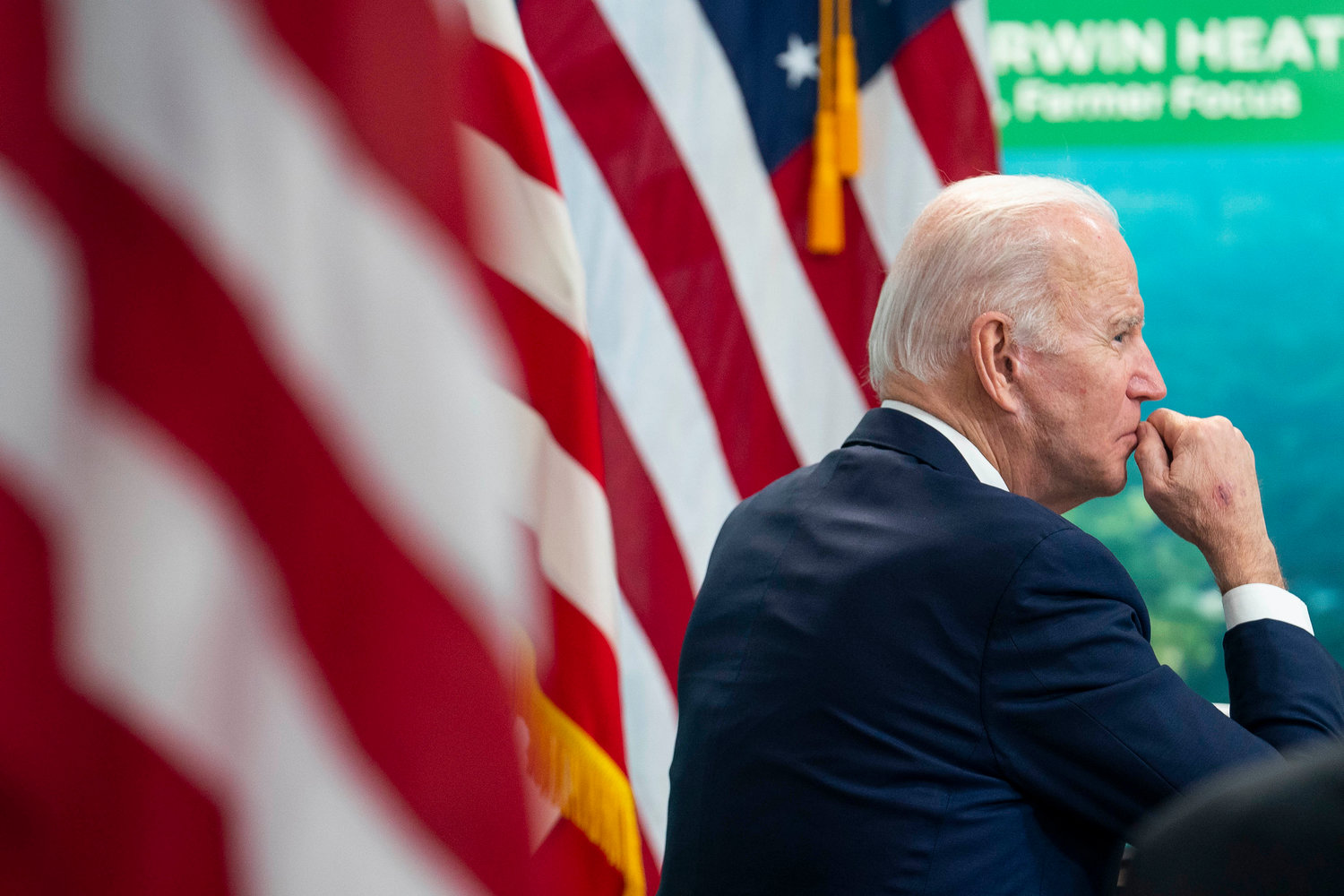 President Joe Biden listens during a virtual meeting in the South Court Auditorium at the Eisenhower Executive Office Building on Jan. 3, 2022, in Washington, D.C. (Sarah Silbiger/Getty Images/TNS)