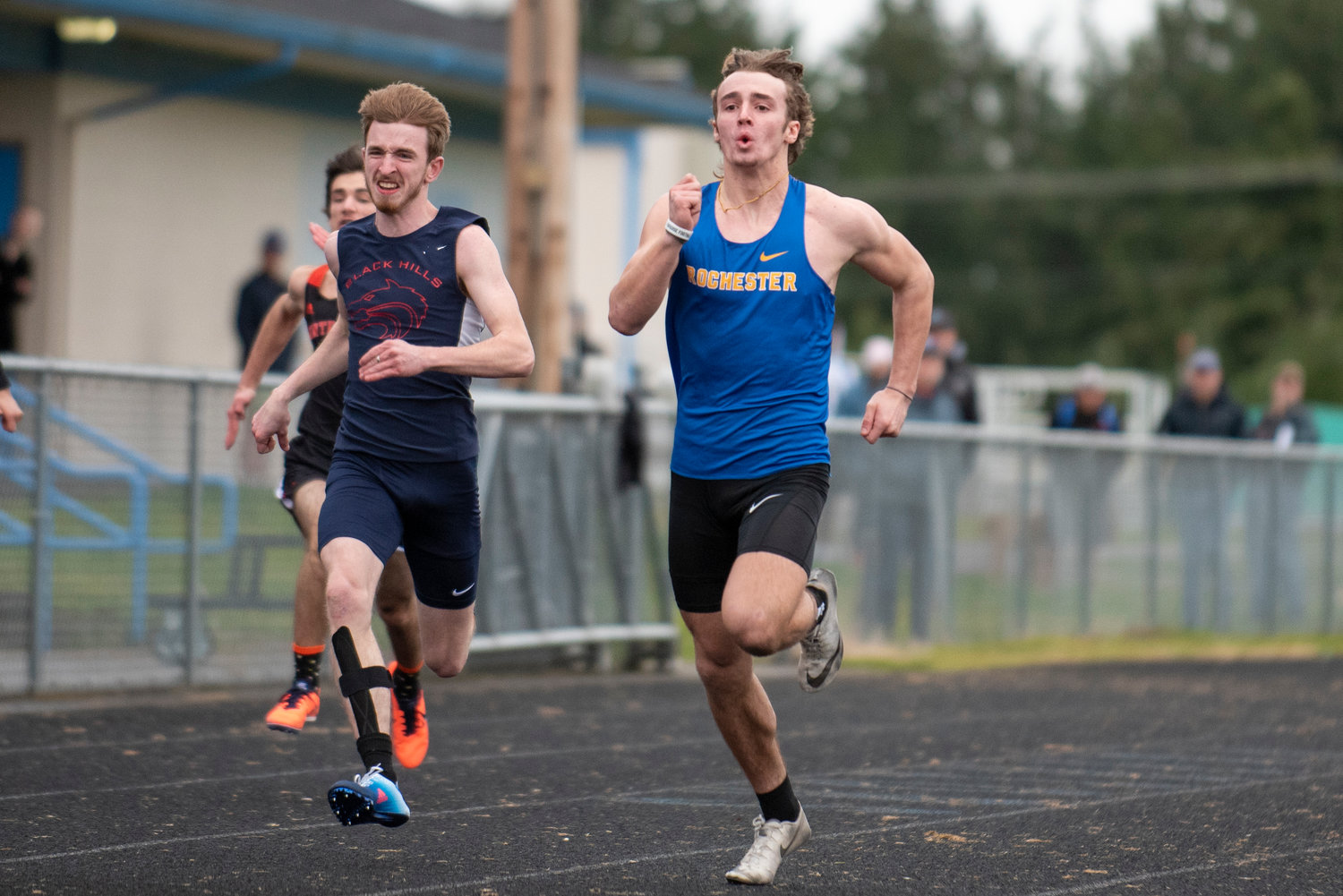 Rochester senior Talon Betts sprints in the boys 100-meter dash during the Warriors' season-opening meet at home against Black Hills and Centralia on Thursday, March 17.