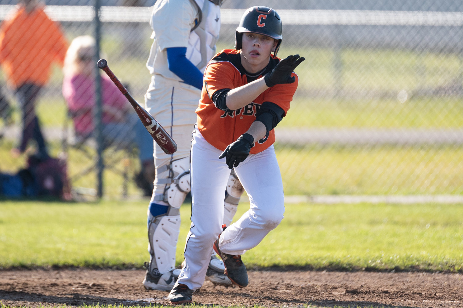 A Centralia player tosses his bat after drawing a walk against Rochester March 22.