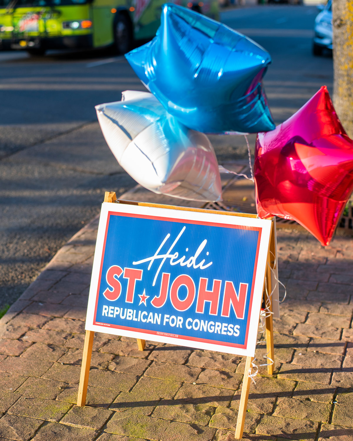 Red, white and blue balloons wave in the wind while tied to a Heidi St. John election sign Tuesday afternoon in downtown Centralia.