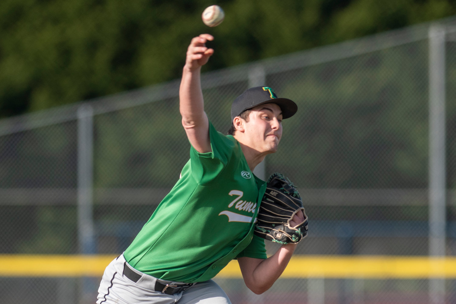 Tumwater pitcher Ryan Orr unleashes a pitch to a Black Hills batter during a rivalry matchup on the road March 24.