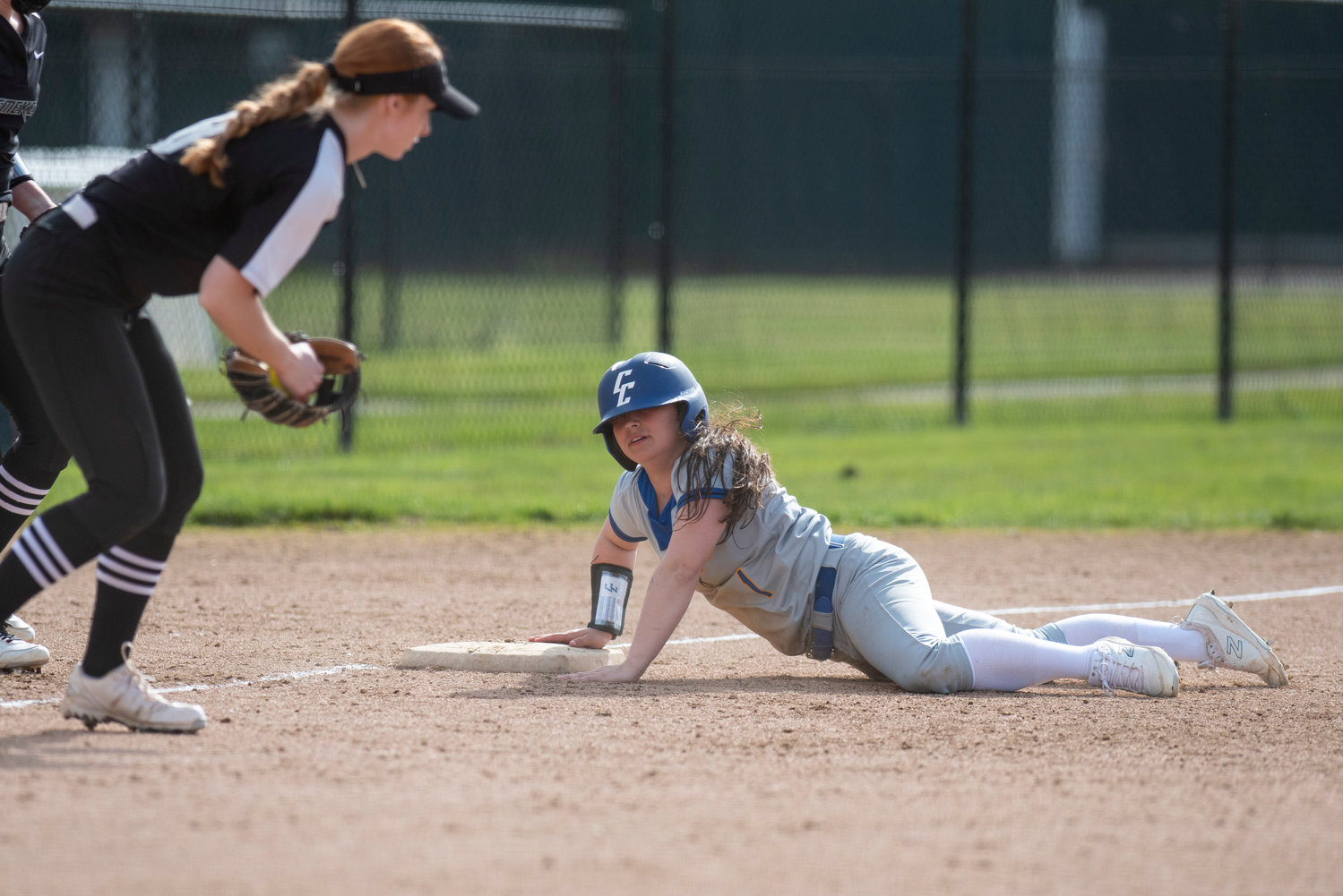Centralia College's Casey Wentz slides safely into third base during a home game against Chemeketa on March 25.