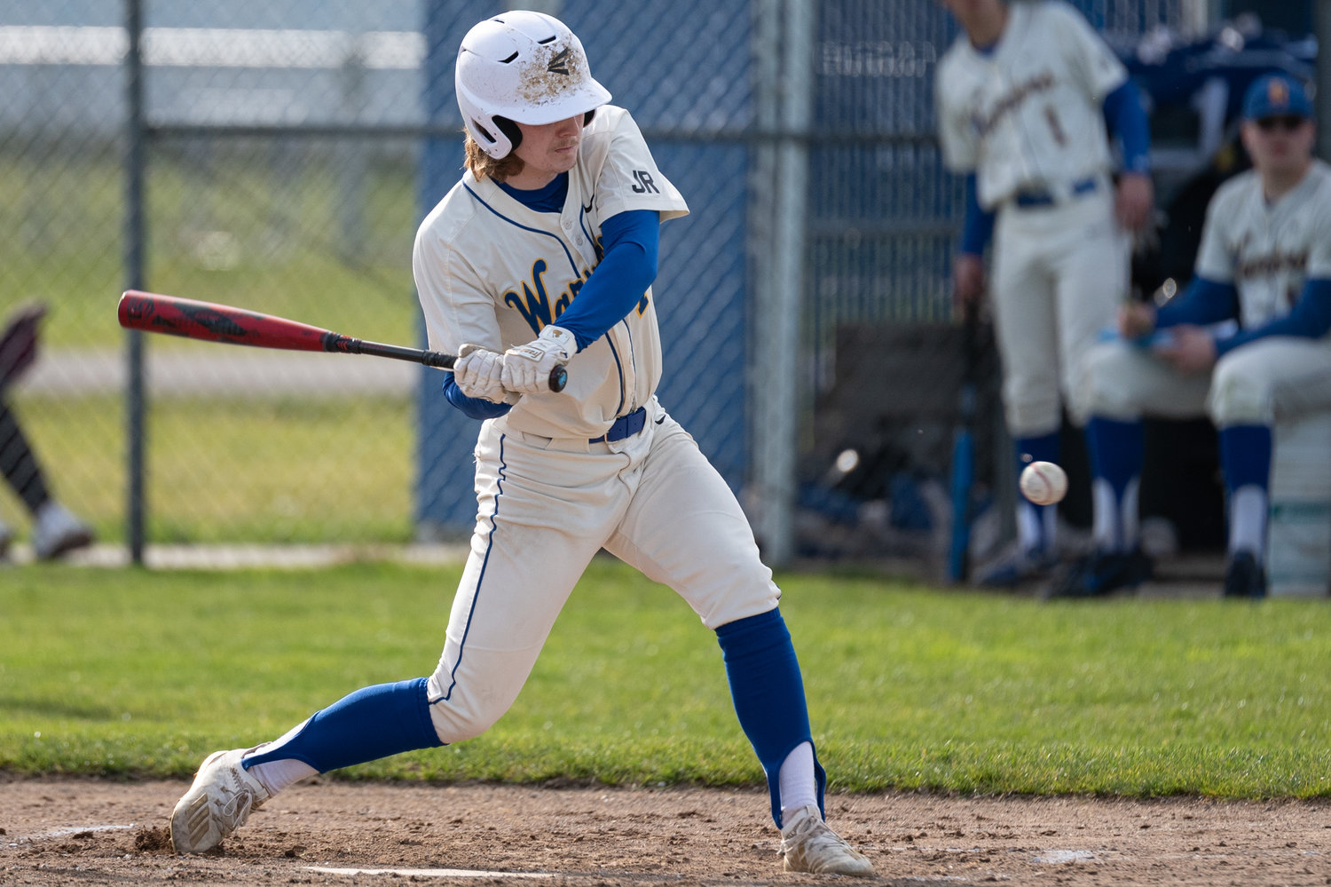 Rochester's Braden Hartley eyes a ball before taking a swing against Shelton April 7.