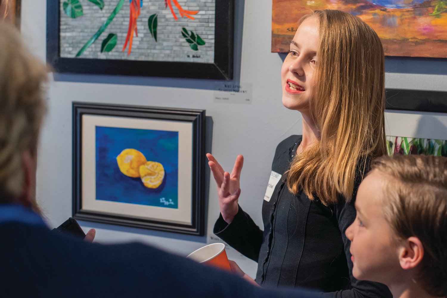 Elizabeth Snell, 12, a student at Edison Elementary talks about her art Friday at the Rectangle Gallery & Creative Space in Centralia.