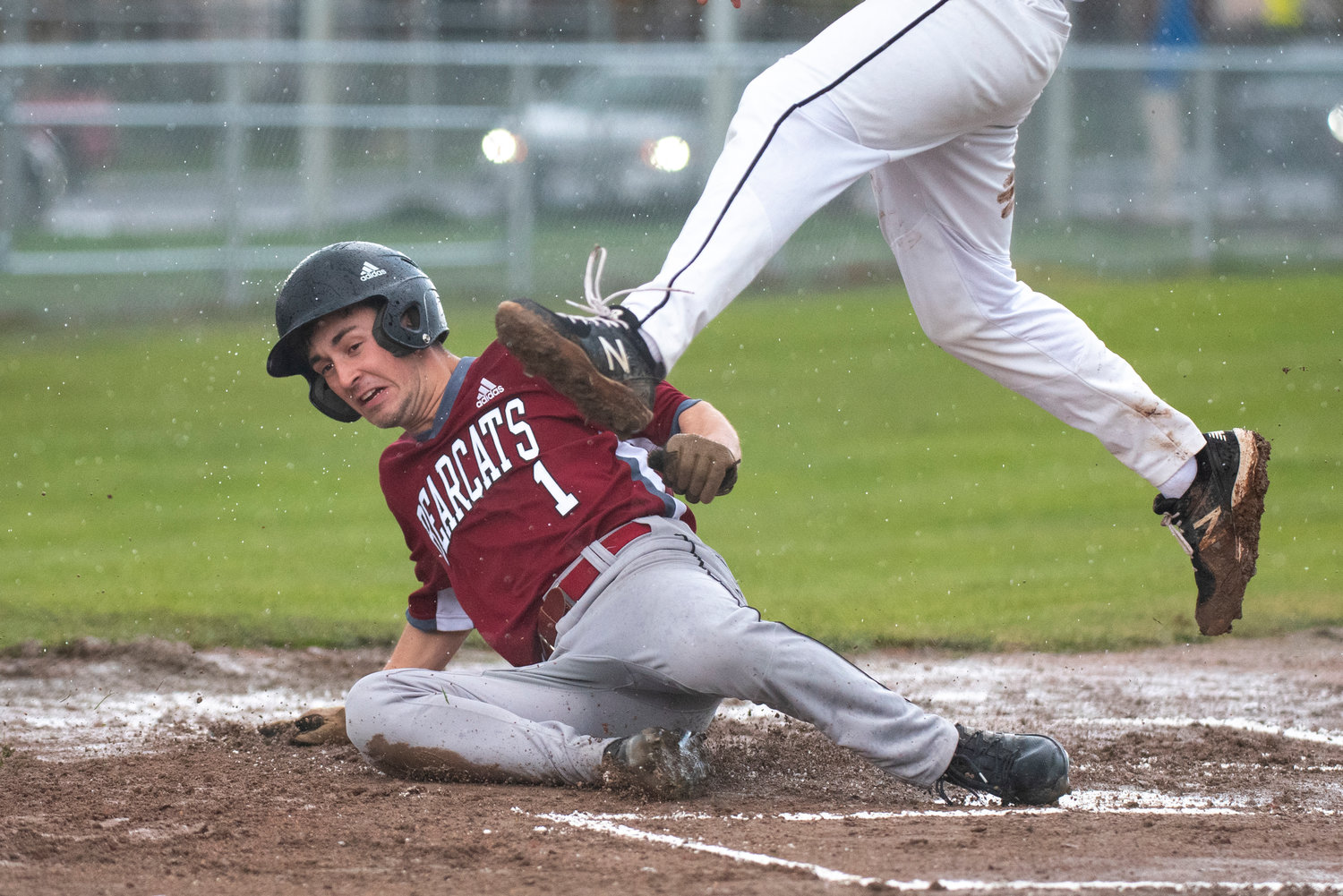 W.F. West's Brock Bunker (1) slides safely into home plate during a road game against Tumwater on April 14.