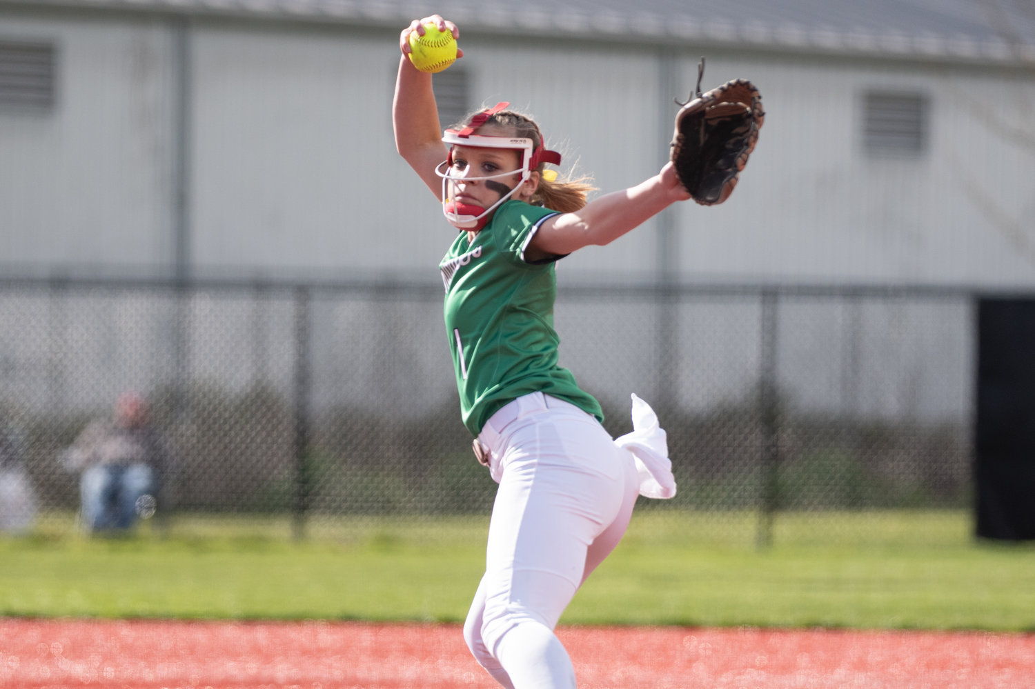 Tumwater's Ella Ferguson winds up to deliver a pitch against W.F. West at Recreation Park in Chehalis April 15.