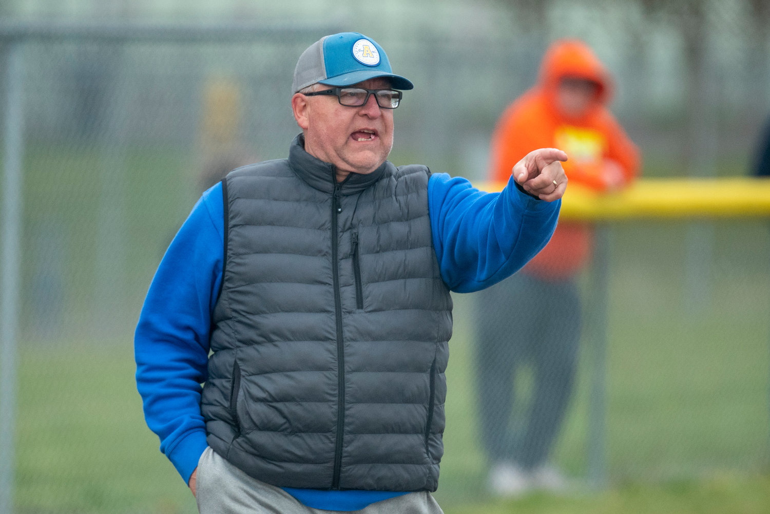Adna coach Bruce Pocklington calls out instructions to his team during a road game in Winlock on April 20.