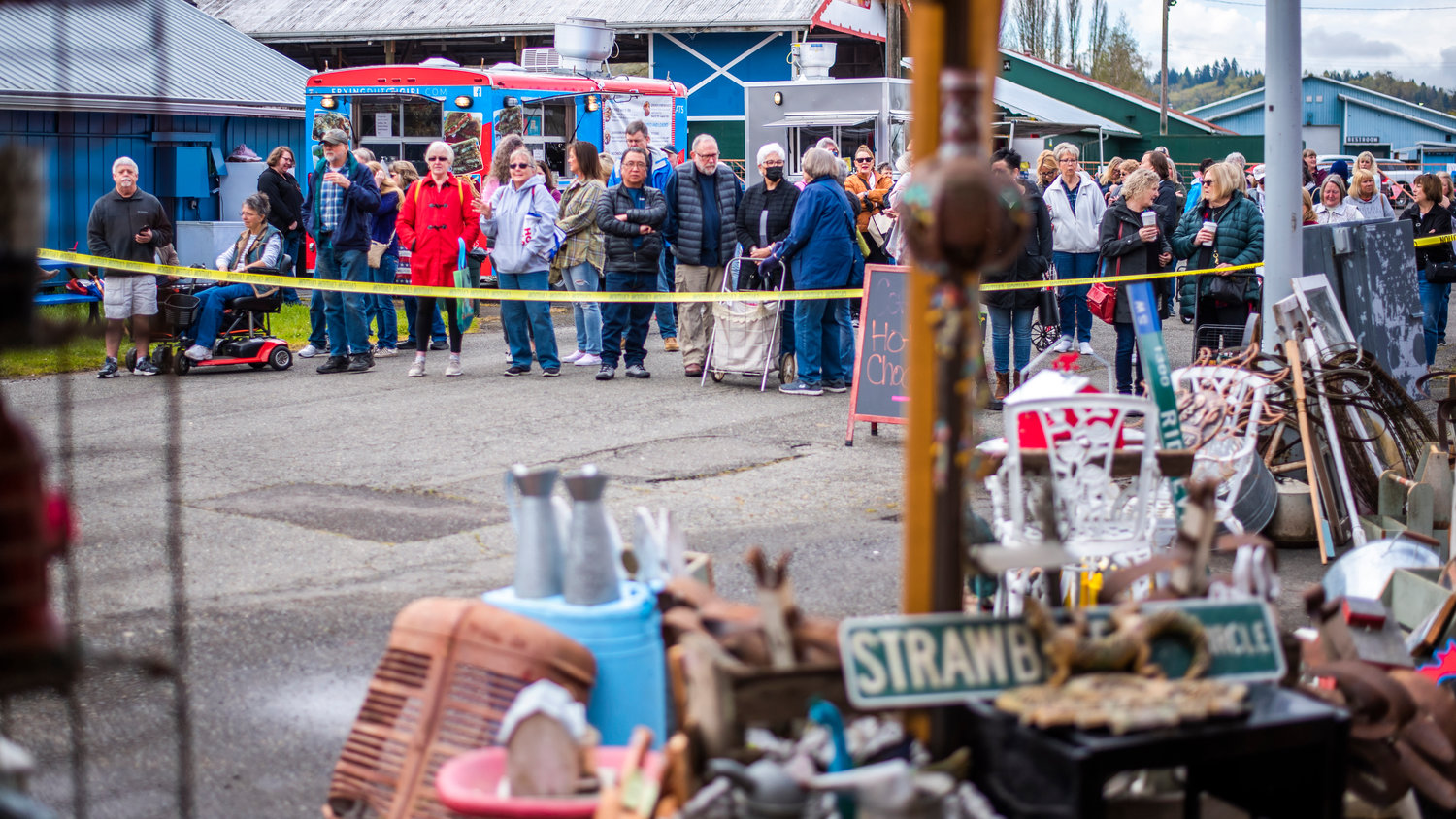 Visitors line up behind yellow tape at the Southwest Washington Fairgrounds in Centralia during the Country Chicks Spring Show on Friday.