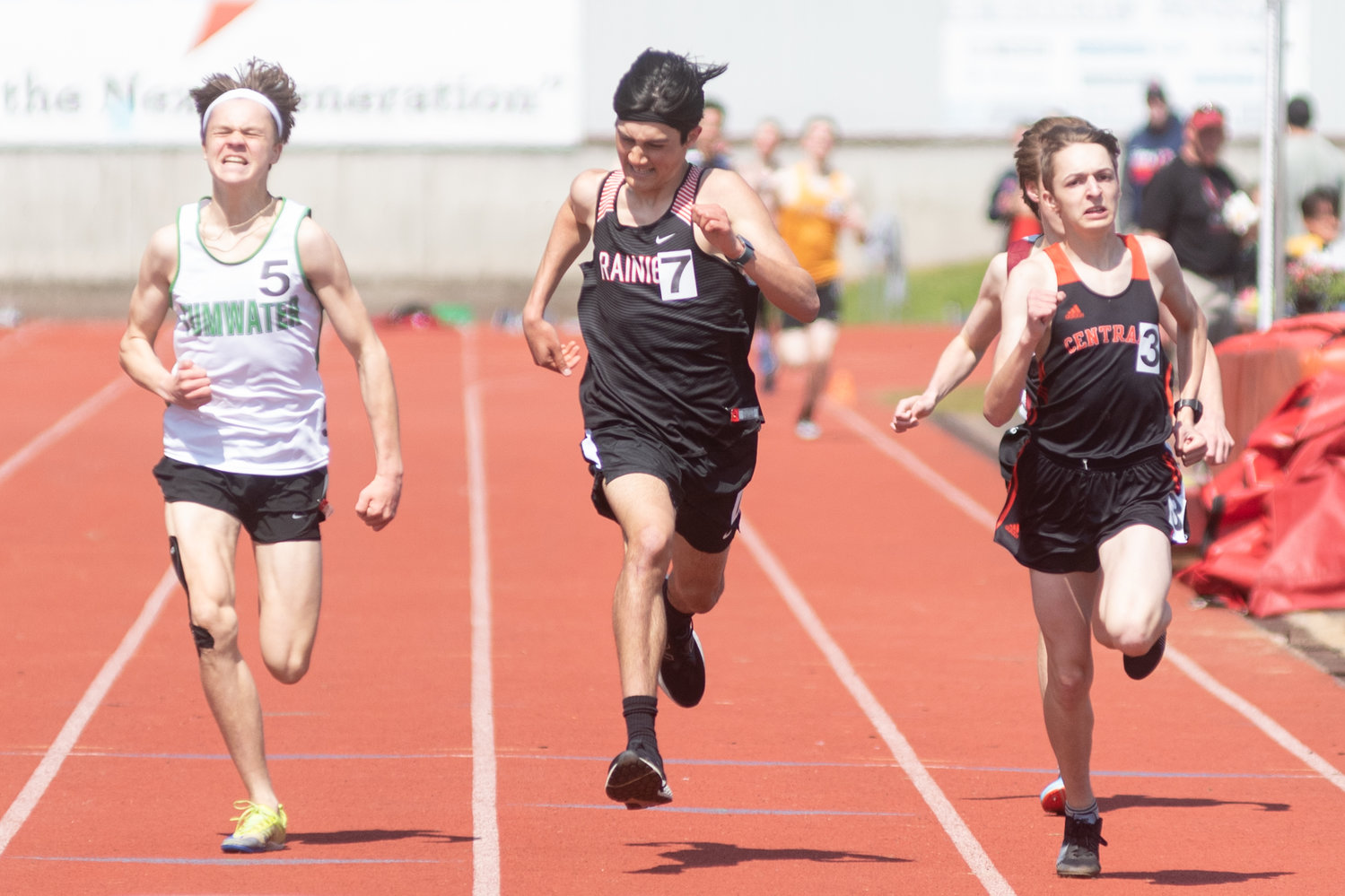 Tumwater's Brenden Hamilton (left), Rainier's Dylan Davis (middle), and Centralia's Devin Harrison (right) race toward a photo finish at the Chehalis Activators Classic April 23 at W.F. West in the 1600 meters.