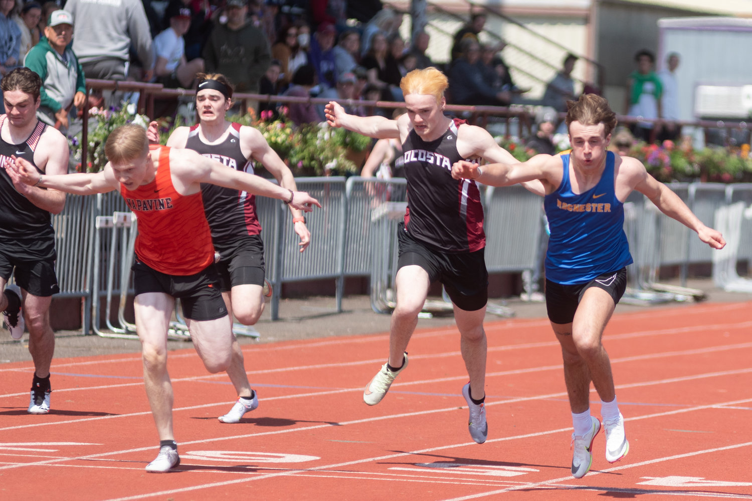 Napavine's Lucas Dahl (left) and Rochester's Talon Betts (right) cross the finish line in the 100 meters at the Chehalis Activators Classic April 23 at W.F. West.