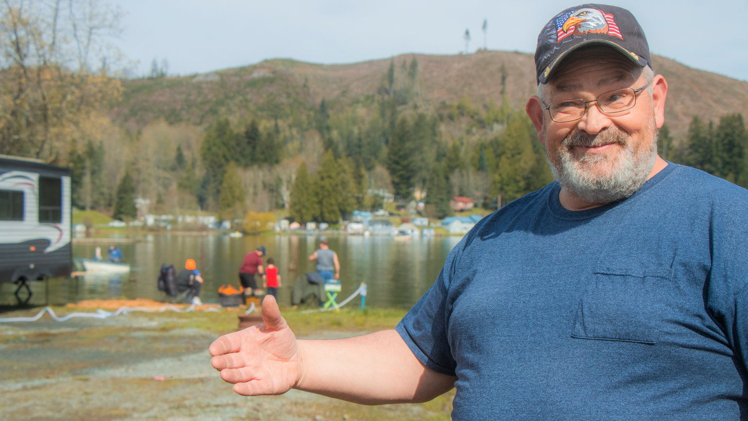 Lions Club Vice President Steven Mayer smiles while pointing out improvements to the Lions Den Campground on Mineral Lake Saturday morning.