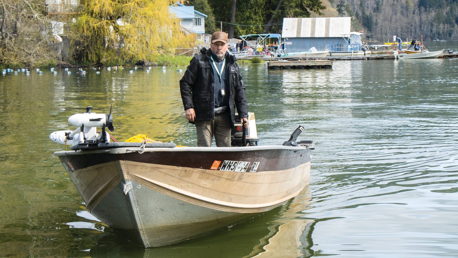 A participant in the Mineral Lake Fishing Derby pilots his boat back to a dock Saturday morning.