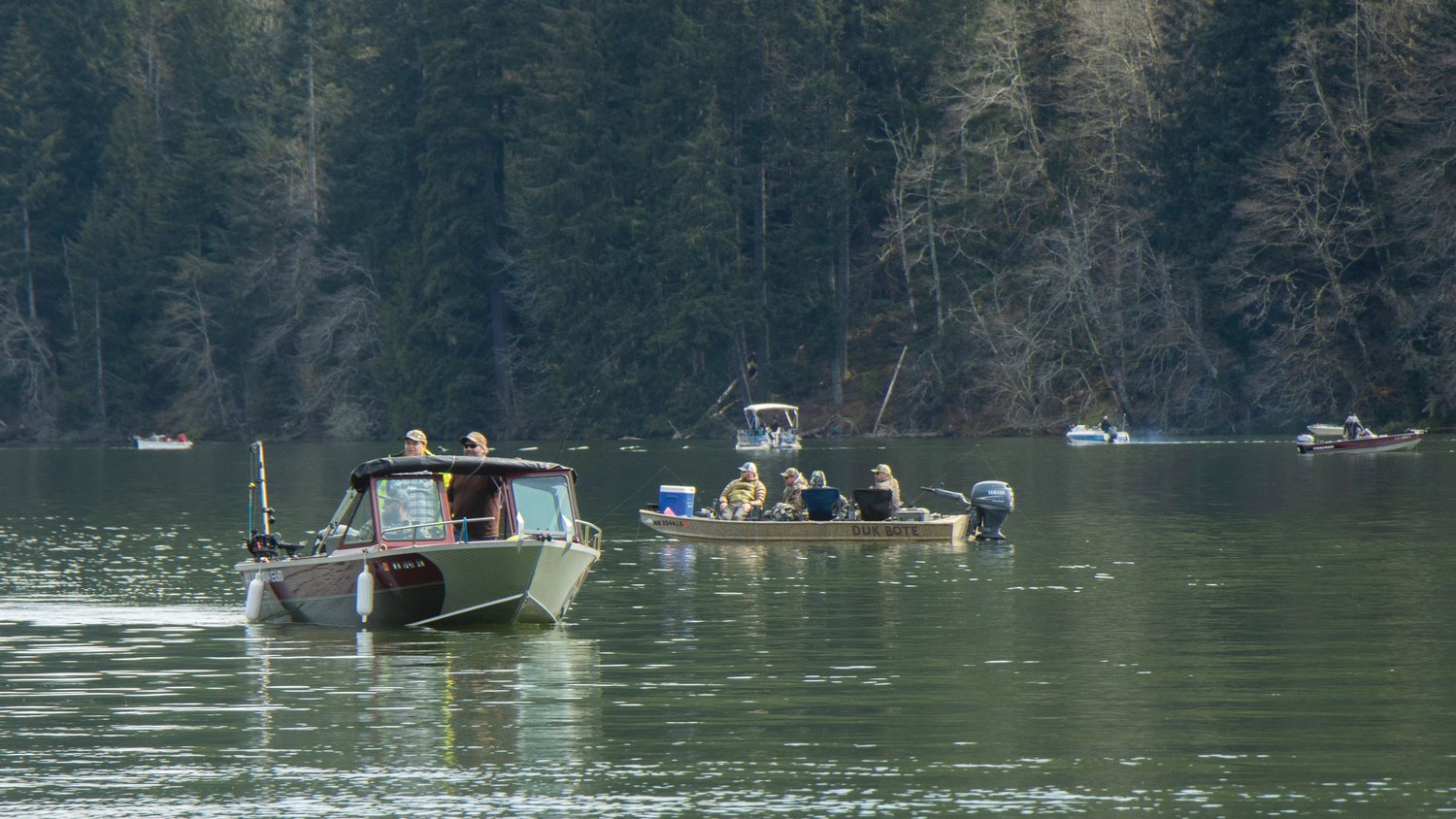 Boats coast across the water during the Mineral Lake Fishing Derby on Saturday.