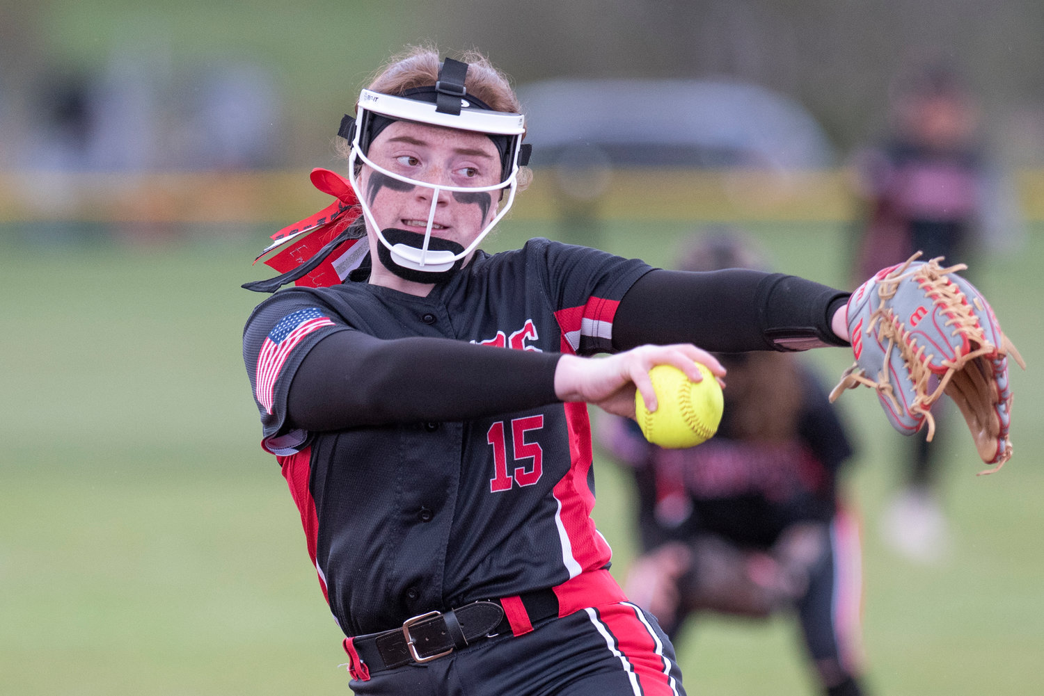 Tenino pitcher Emily Baxter winds up to deliver a pitch to an Elma batter during a league home game on April 26.