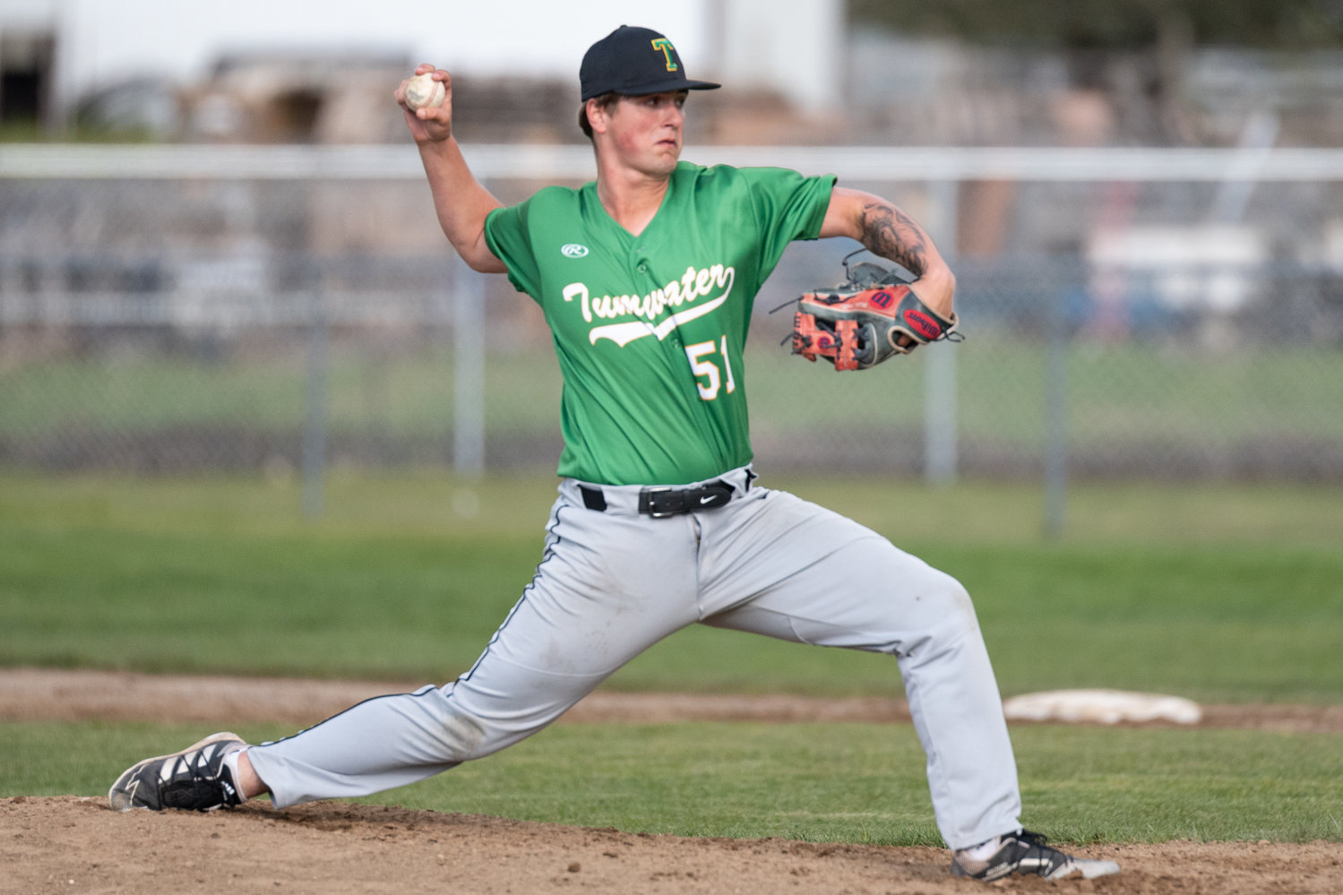 Tumwater pitcher Blake Smith winds up to deliver a pitch out of the bullpen against Rochester April 27.