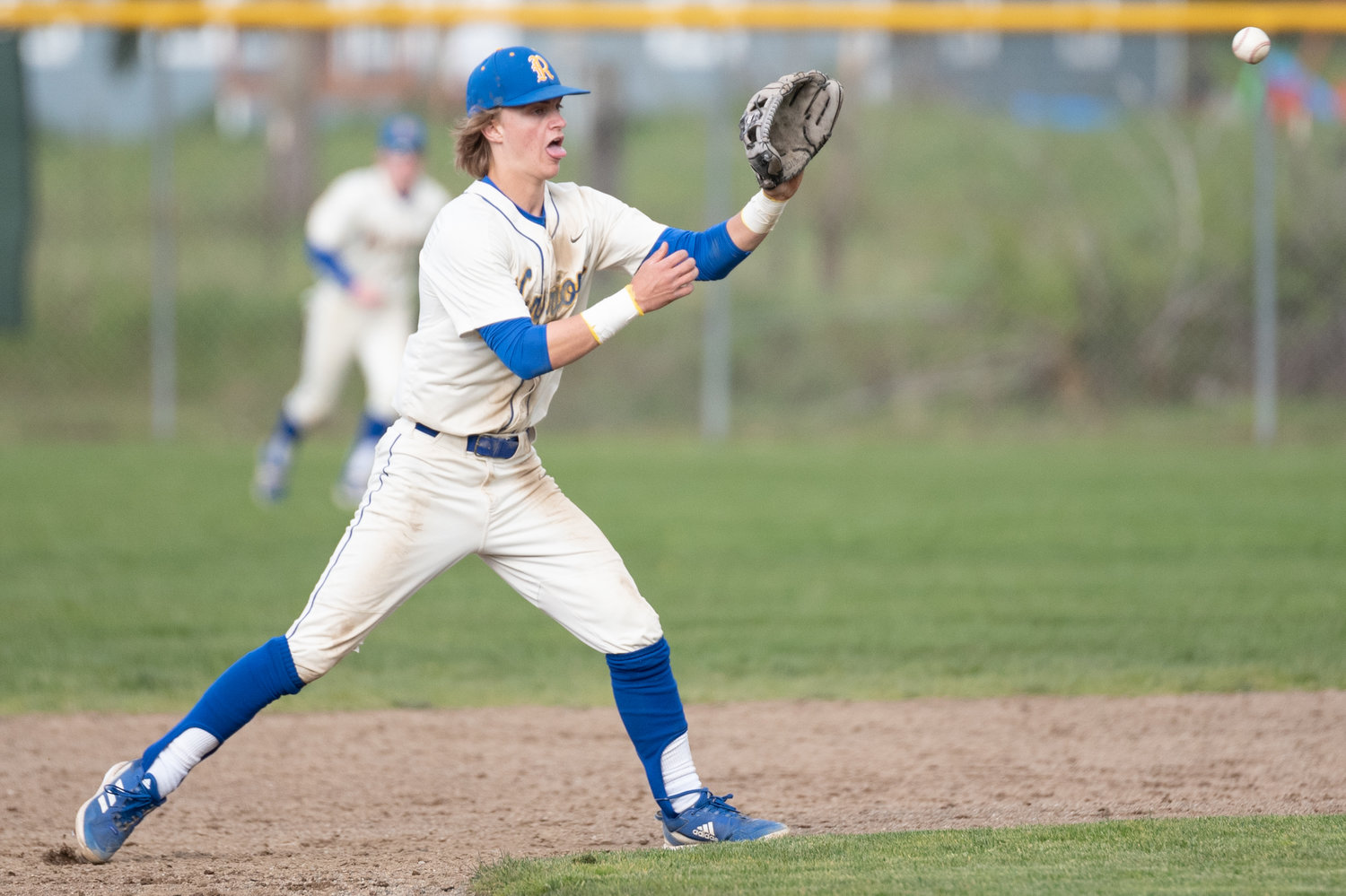 Rochester shortstop Landon Hawes looks to make a play against Tumwater April 27.