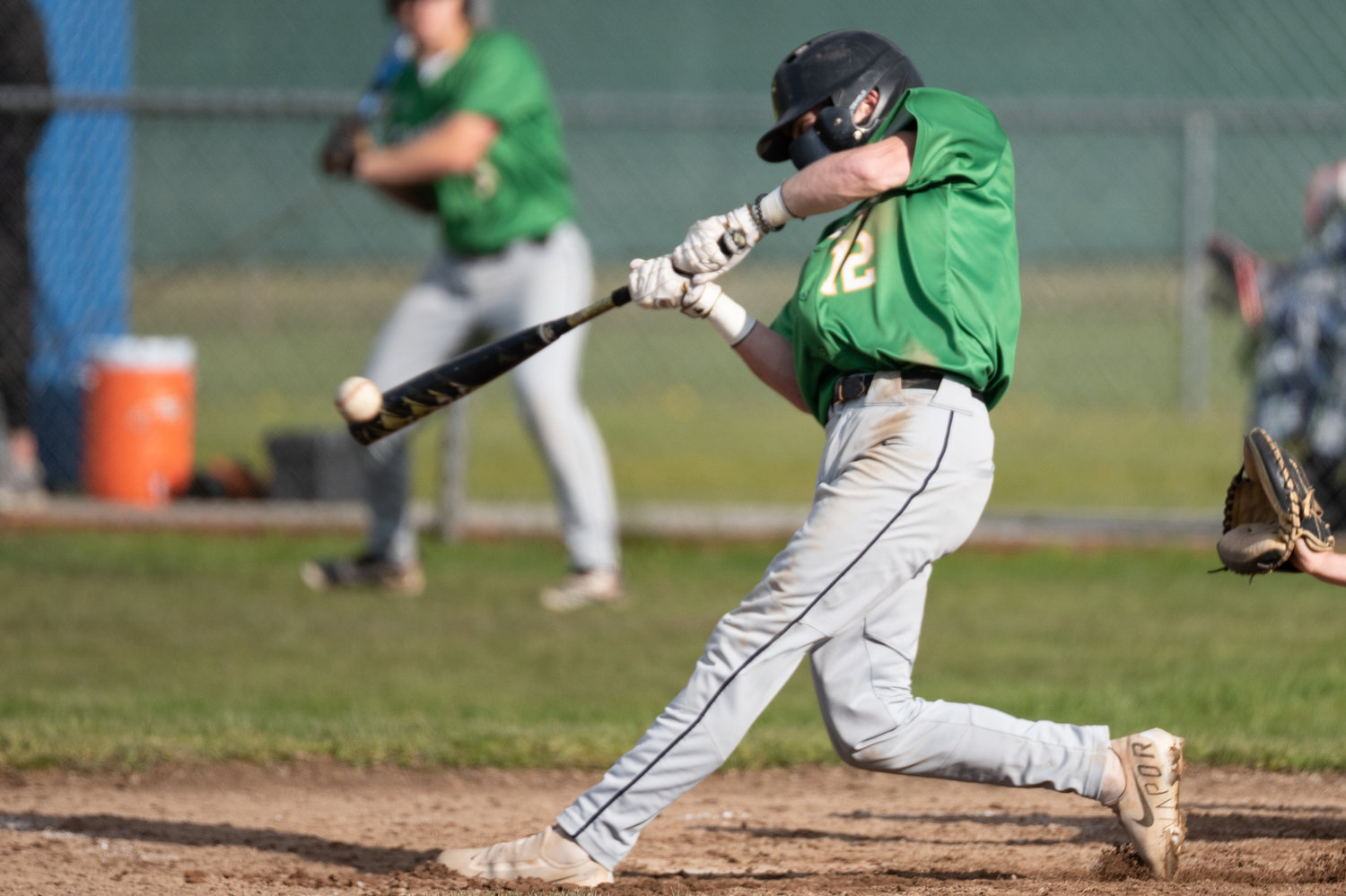 Tumwater's Brayden Oram makes contact with a pitch against Rochester April 27.