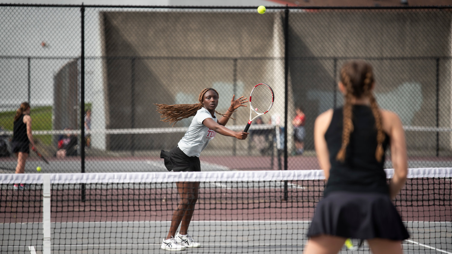 Mariama Ceesay, first doubles player for W.F. West, hits a backhand volley against Centralia’s Maddie Corwin at W.F. West on Friday.