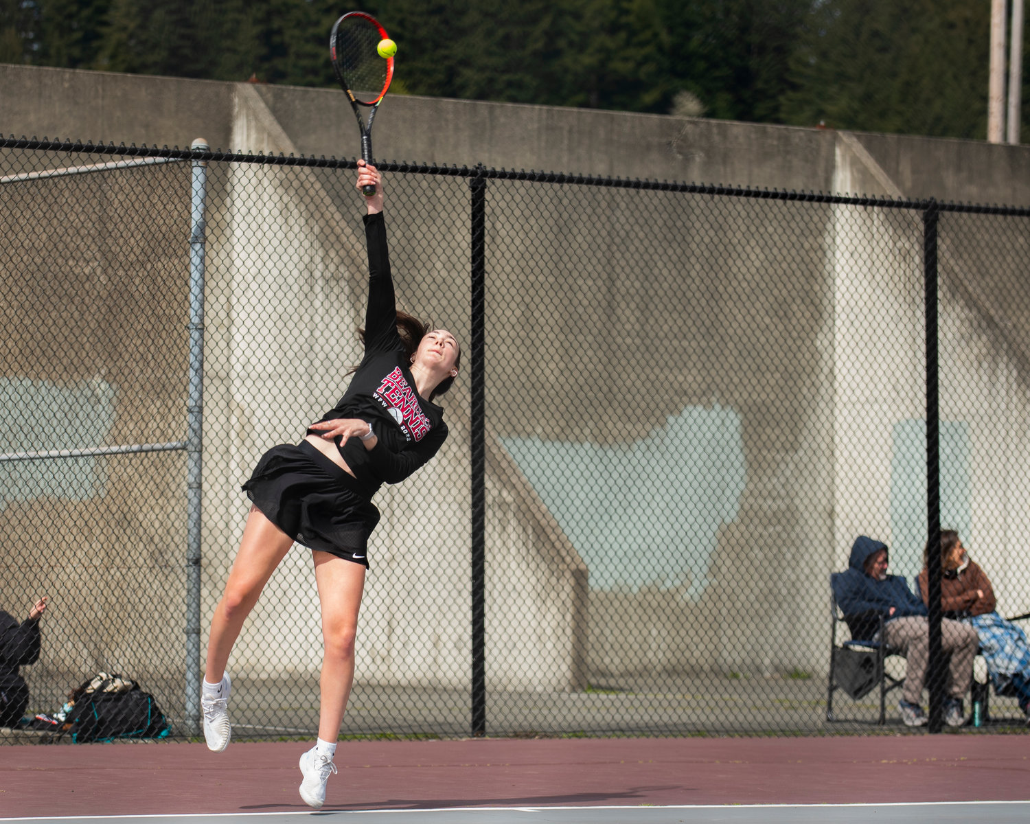 Claire Kuykendall, first singles player for W.F. West, serves against Centralia in Chehalis on Friday.