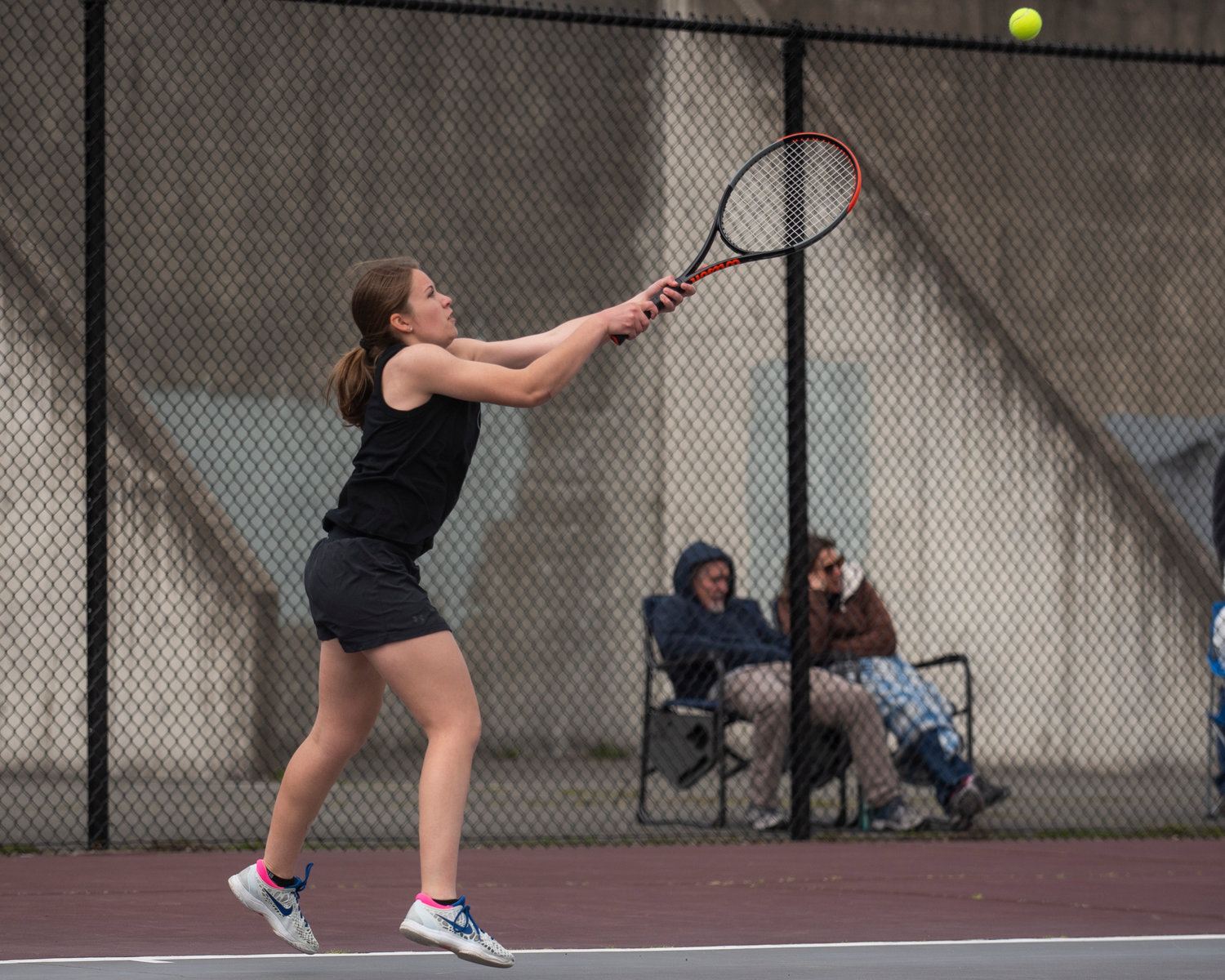 Evie Rooklidge, first singles player for Centralia, hits a backhand against W.F. West in Chehalis on Friday.