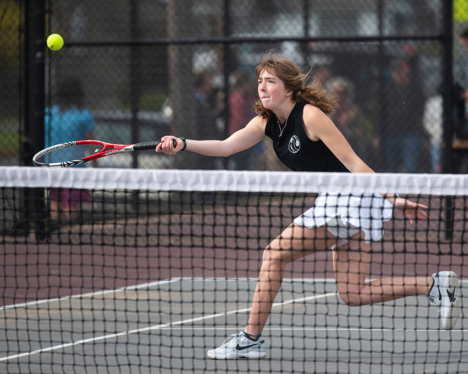 Liza Hopkins, Centralia’s first doubles player, hits a volley against W.F. West on Friday.
