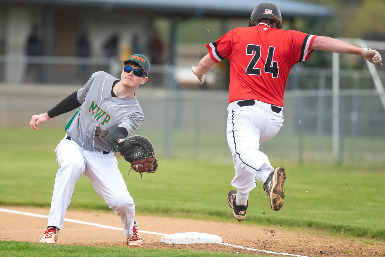 Morton-White Pass first baseman Jace Peters catches a throw to first as a Wahkiakum player tries to beat the throw during a pigtail playoff game in Adna on May 3.