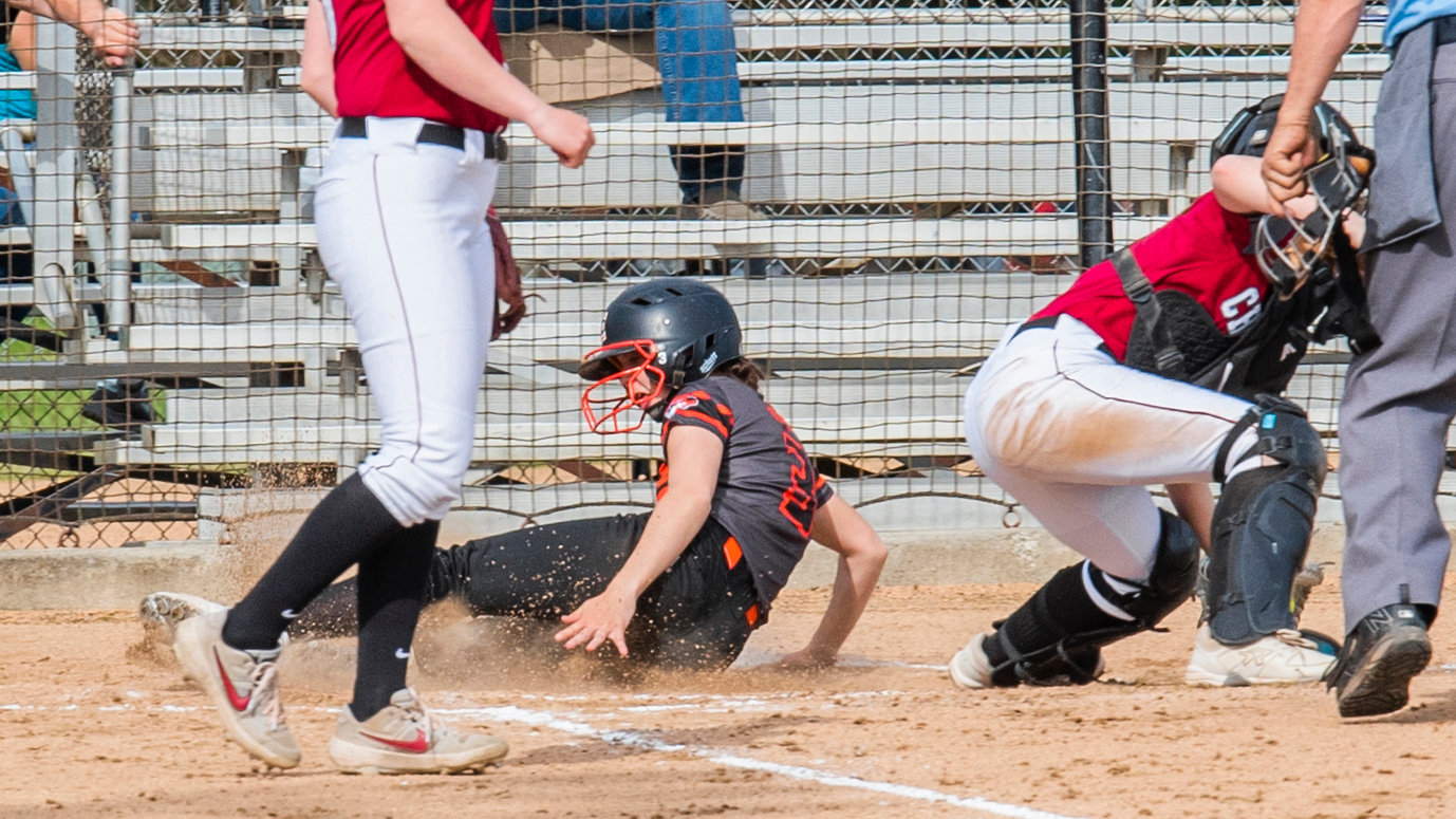 Centralia’s Ella Orr (3) slides into home plate during a game against W.F. West on Wednesday.
