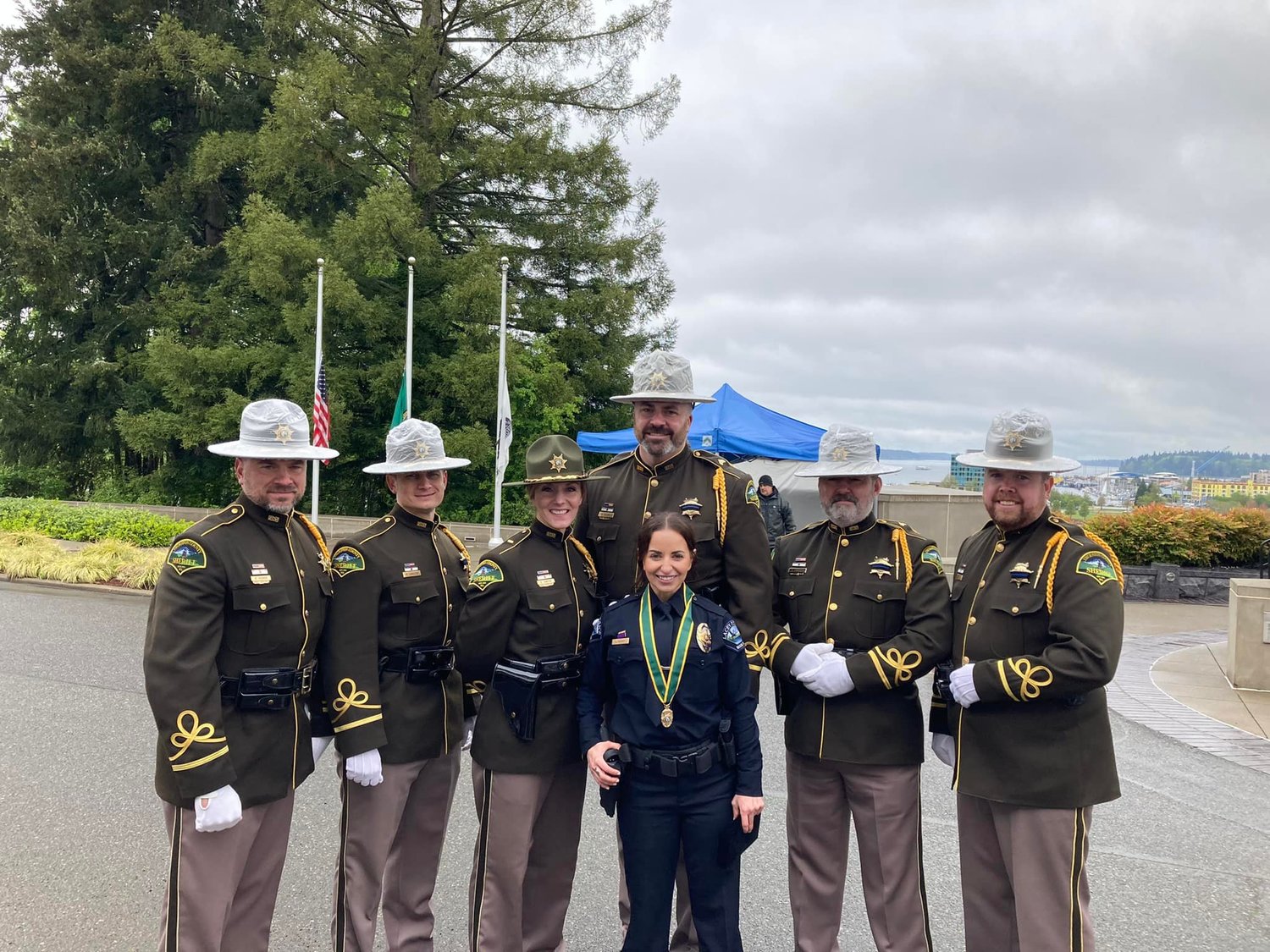 Former Thurston County Deputy Andrea Moore, center, is pictured with the Thurston County Sheriff’s Office Honor Guard on May 6 at the  Washington State Law Enforcement Medal of Honor and Peace Officers Memorial Ceremony.
