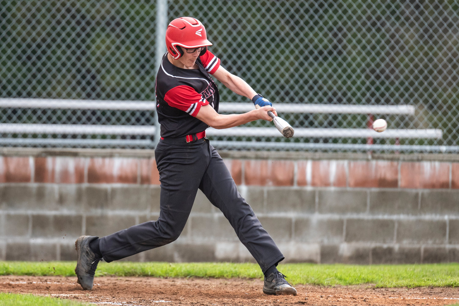 Mossyrock's Hunter Isom connects on a Lake Quinault pitch during a district playoff win at home on May 9.