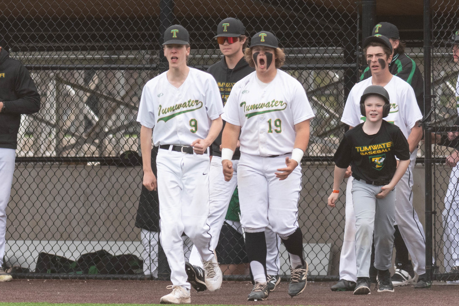 The Tumwater dugout celebrates an out against Shelton in the 2A District 4 semifinals May 11 at Ridgefield.
