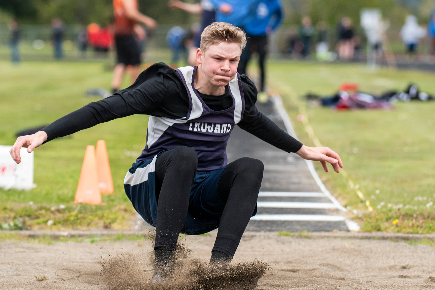 Pe Ell's Jesse Justice lands in the long jump pit during the 1B District IV track and field championships in Raymond on May 11.