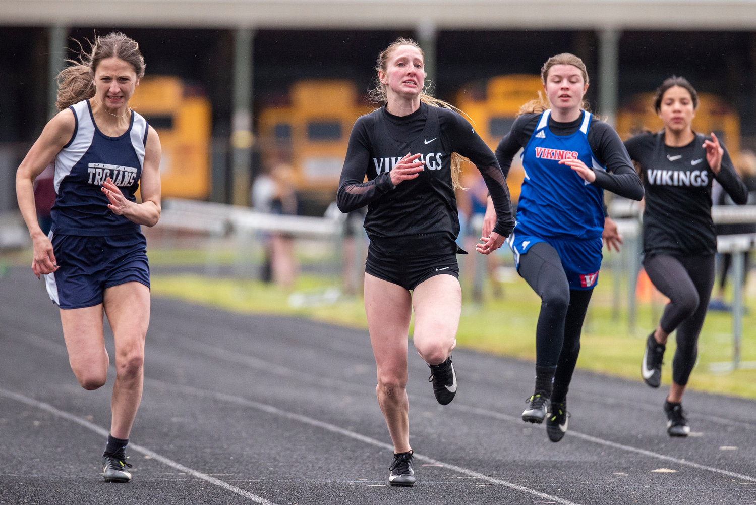 Mossyrock's Teaguen Weise, second from left, leads the pack in the 100-meter dash, with Pe Ell's Charlie Carper, left, in hot pursuit. Weise won the event and Carper placed second.