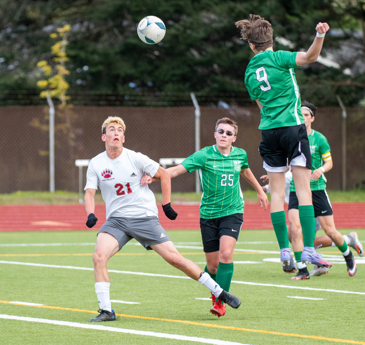 W.F. West's Gideon Priest (21) looks for a cross against Tumwater during the district semifinals on May 12.